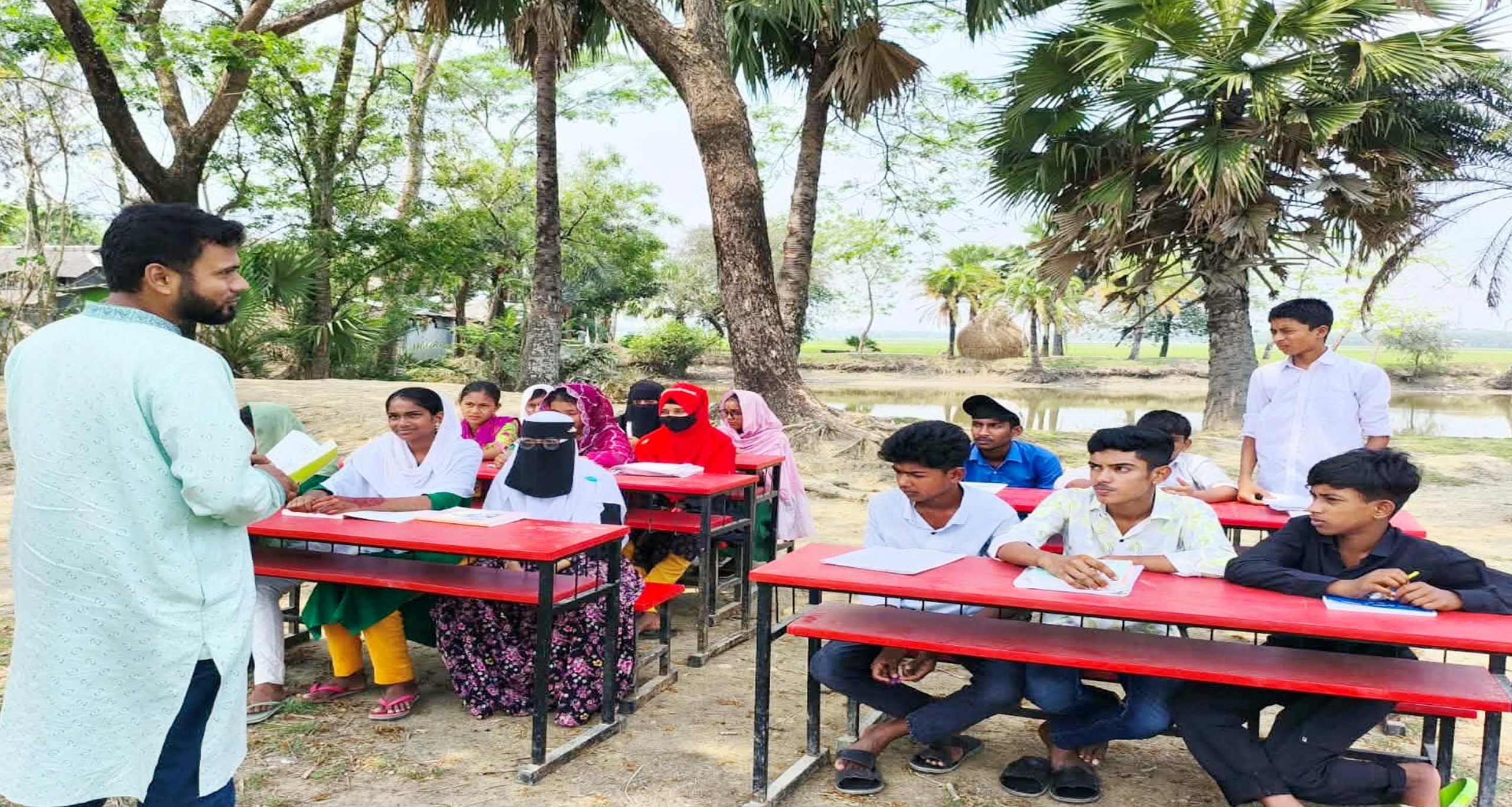 ৩৬ বছরেও জোটেনি উন্নয়ন, তালতলীতে খোলা আকাশের নিচেই চলছে পাঠদান